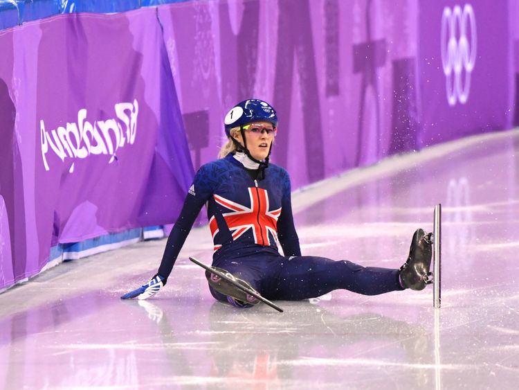 Elise Christie looks on after crashing out of the 500m short track final