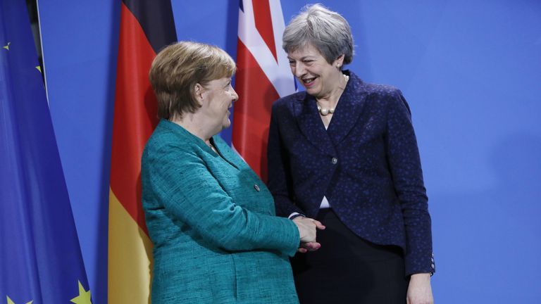 Mrs May with Angela Merkel (L) in Berlin on Friday