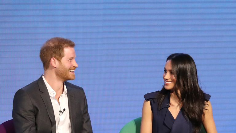 Meghan Markle and Prince Harry enjoy a joke together at the event