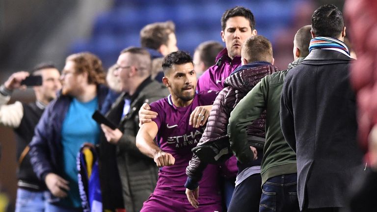 Sergio Aguero appears to confront a fan after the Man City Wigan FA cup tie