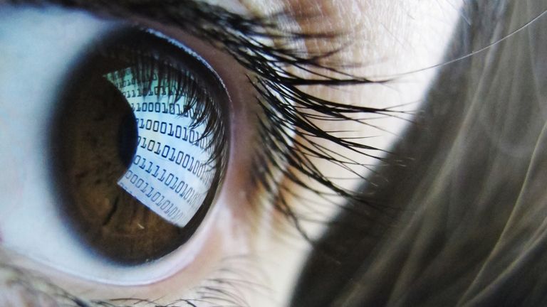 A pictures shows binary code reflected from a computer screen in a woman&#39;s eye on October 22, 2012. AFP PHOTO / LEON NEAL (Photo credit should read LEON NEAL/AFP/Getty Images)
