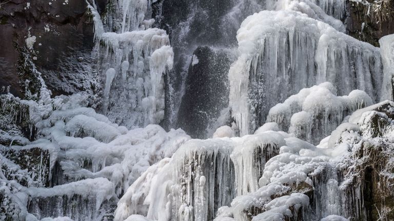 The frozen Nideck waterfall in Oberhaslach, eastern France