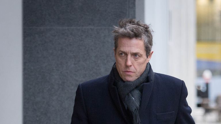 Hugh Grant arrives at the Rolls Building in London after he settled his phone hacking claims against Mirror Group Newspapers