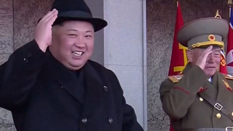 Kim Jong Un watches a military parade in Pyongyang