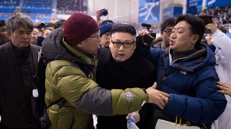 A Kim Jong Un impersonator is forced out in the final period of the women&#39;s preliminary round ice hockey match between Japan and the Unified Korean team during the Pyeongchang 2018 Winter Olympic Games at the Kwandong Hockey Centre in Gangneung on February 14, 2018. 