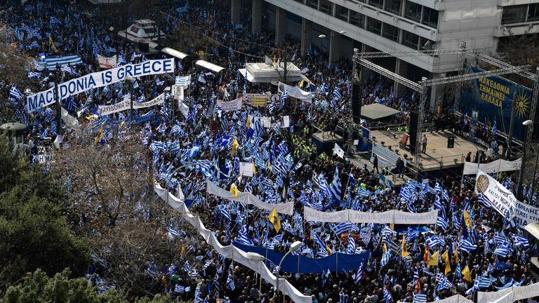 Demonstrators wave Greek national flags during a demonstration in Athens on February 4, 2018. Hundreds of thousands of Greeks are expected to join an Athens rally to urge the government not to compromise in the festering name row with neighbouring Macedonia, organisers said