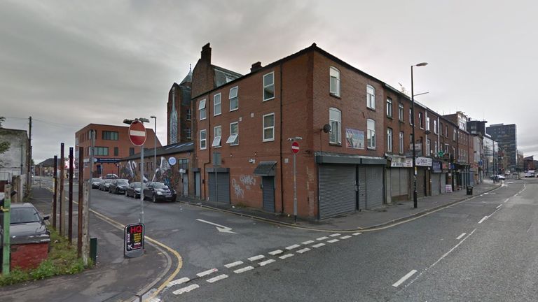 The victim's body was discovered in a flat in Swan Street, Manchester