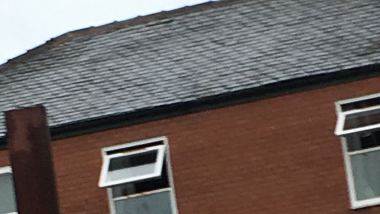 Blood can be seen on the second-floor window of a flat in Swan Street. Pic: Jonathan Ward
