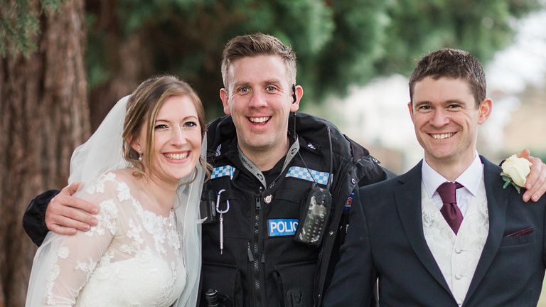Police made time for photos with the married couple after making the arrests. Pic: Annie Crossman Photography