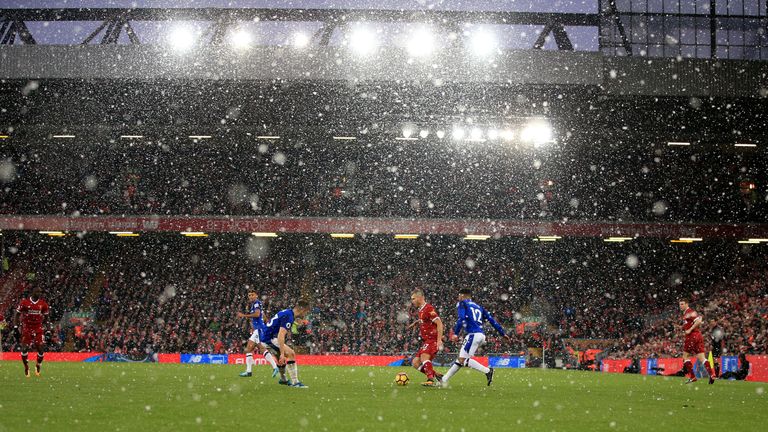Snow falls during the Premier League match at Anfield, Liverpool.  Peter Byrne/PA Wire/PA Image. EDITORIAL USE ONLY No use with unauthorised audio, video, data, fixture lists, club/league logos or "live" services. Online in-match use limited to 75 images, no video emulation. No use in betting, games or single club/league/player publications.