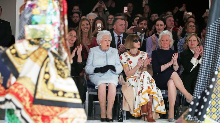 The Queen appeared surprised at some of the outfits as she sat next to Anna Wintour