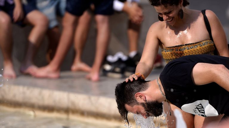 Tourists cool off in Rome during a heatwave in 2015
