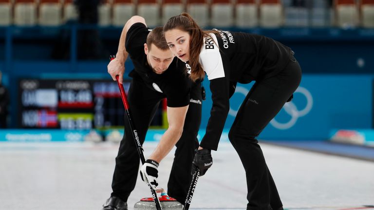 Alexander Krushelnitsky and Anastasia Bryzgalova in action in the mixed doubles bronze medal match