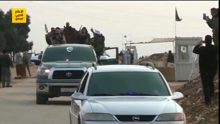 The troops cross a checkpoint in Afrin