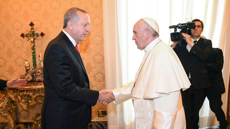 Pope Francis welcomes Turkish President Tayyip Erdogan during a private audience at the Vatican