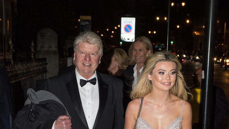 Stanley Johnson, father of Boris Johnson, and Georgia Toffolo, reality TV star, arrive for the Conservative party Black and White Ball at Natural History Museum on February 7, 2018 in London, England.