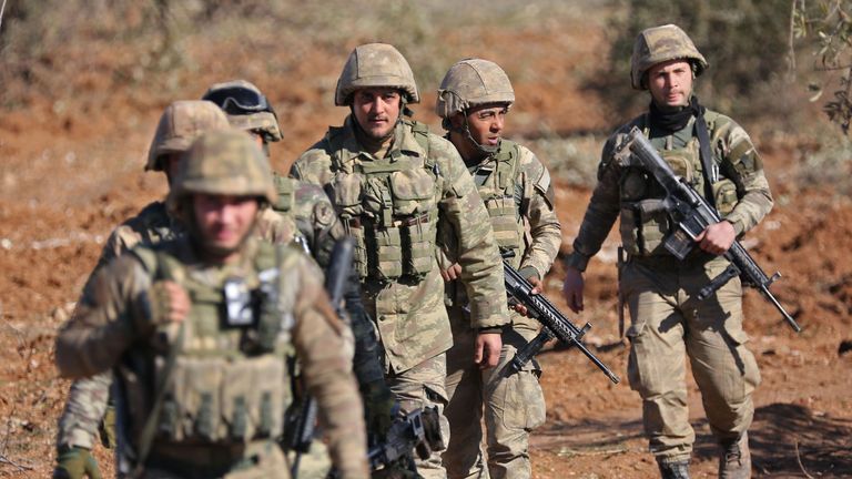 Turkish soldiers are deployed on Mount Bersaya, north of the Syrian town of Azaz near the border with Turkey, on January 29, 2018. Turkey launched operation 'Olive Branch' on January 20 against the Syrian Kurdish People's Protection Units (YPG) militia in Afrin, supporting Syrian opposition fighters with ground troops and air strikes