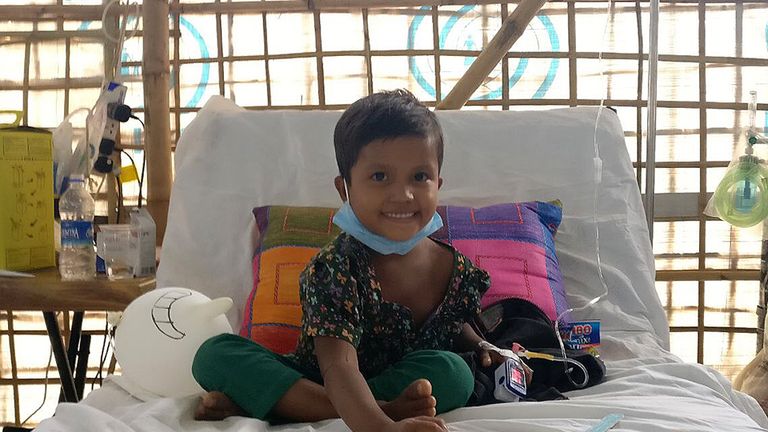 Six-year-old Sumaiya, sitting up in bed and already recovering after receiving diphtheria antitoxin treatment