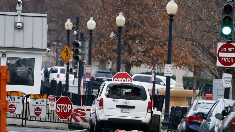 A white Chevrolet struck a security barrier near the White House