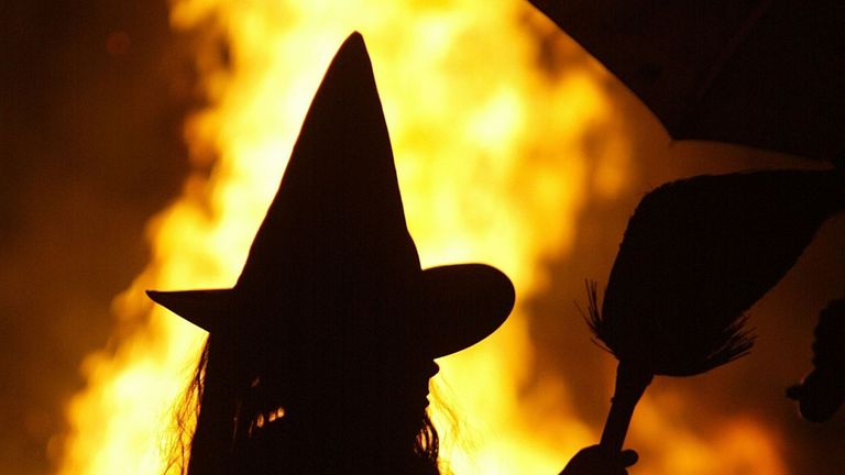 HUNTINGTOWN, MD - OCTOBER 25: Dressed as a witch, Leigh Kosega stands near a bonfire October 25, 2003 in Huntingtown, Maryland. With the sniper suspect arrested, parents in the Washington, DC-area feel a little safer about having their children go &#39;trick or treating&#39; on Halloween night this year. (Photo by Mark Wilson/Getty Images)
