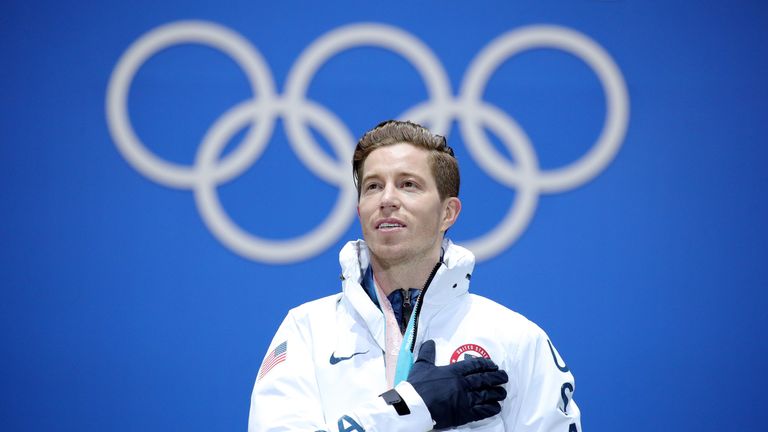 Gold medalist Shaun White of the United States poses during the medal ceremony for the Snowboard Men's Halfpipe
