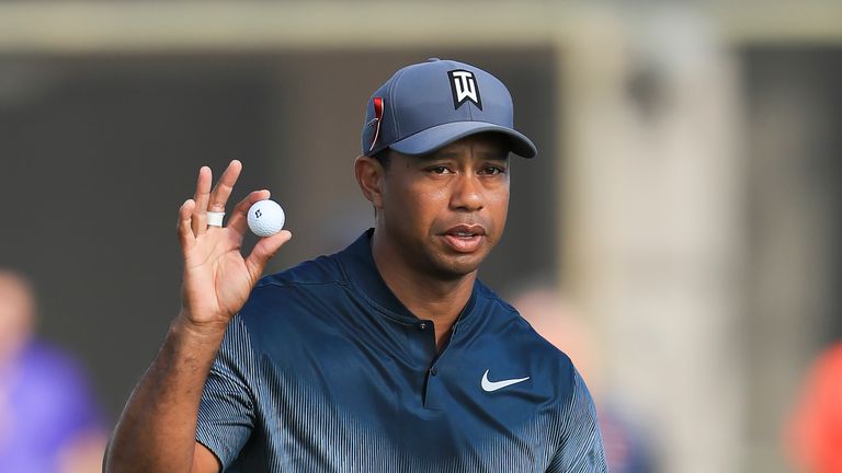 PALM BEACH GARDENS, FL - FEBRUARY 22:  Tiger Woods reacts after a putt on the 14th hole during the first round of the Honda Classic at PGA National Resort 