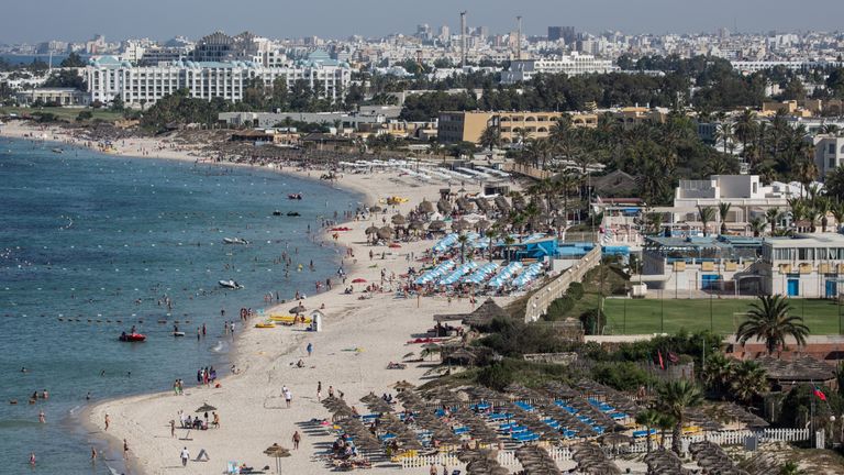 Tourists enjoy the beach on June 25, 2016 in Sousse, Tunisia.