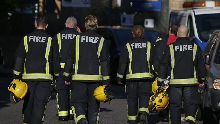 Firefighters walk away from the burning 24 storey residential Grenfell Tower block in Latimer Road, West London on June 14, 2017 in London, England. The Mayor of London, Sadiq Khan, has declared the fire a major incident as more than 200 firefighters are still tackling the blaze while at least six are dead and 20 are in critical care. (Photo by Jack Taylor/Getty Images)