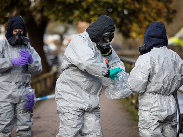 Police officers in protective suits and masks at the scene of the nerve agent attack