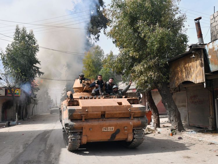 Turkish-backed Syrian rebels driving through Afrin
