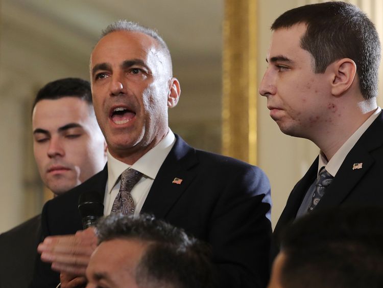 Andrew Pollack (C), whose daughter Meadow Pollack was shot to death last week at Marjory Stoneman Douglas High School, is joined by his sons as he addresses a listening session with U.S. President Donald Trump in the State Dining Room at the White House February 21, 2018 in Washington, DC. Trump hosted the session about school safety in the wake of last week's mass shooting at Marjory Stoneman Douglas High School in Parkland, Florida, that left 17 students and teachers dead. (Photo by Chip Somod