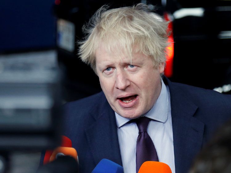 Britain&#39;s Foreign Secretary Boris Johnson talks to the media as he arrives at an European Union foreign ministers meeting in Brussels