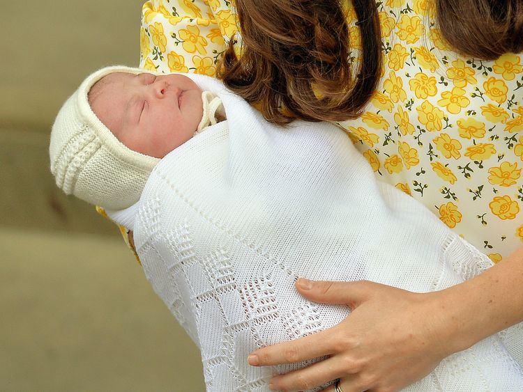 Catherine holds Princess Charlotte outside the Lindo wing