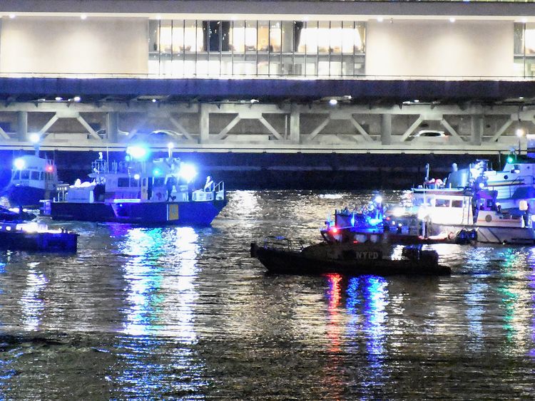 Emergency responders work at the scene of a helicopter crash in the East River March 11, 2018 in New York City. According to reports at least two people were killed