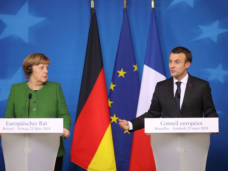 French president Emmanuel Macron speaks during a joint press conference with Germany&#39;s Chancellor Angela Merkel (L) on the second day of a summit of European Union (EU) leaders on March 23 2018, in Brussels.