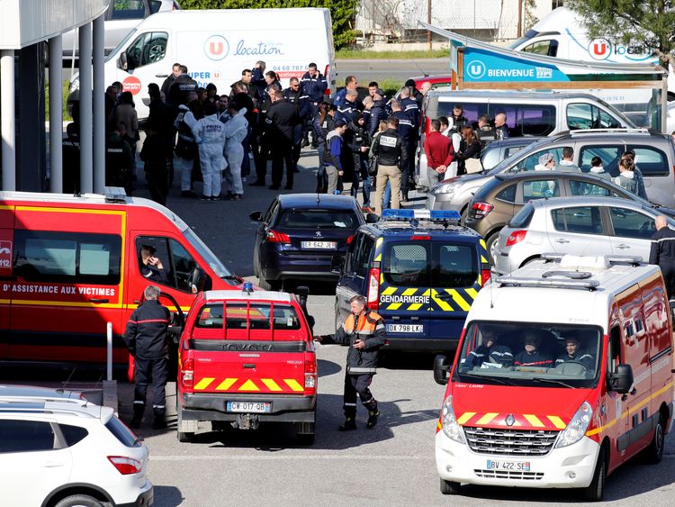Rescue forces and police officers after the hostage situation in Trebes