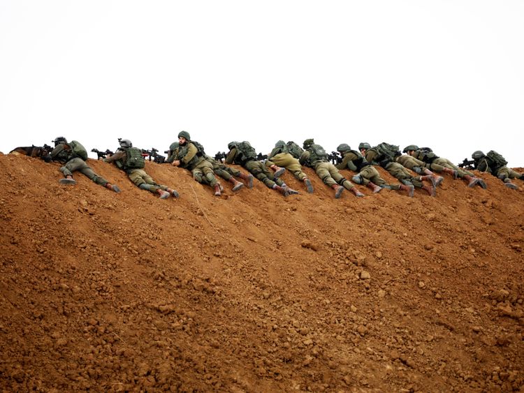 Israeli soldiers are seen near the Gaza border