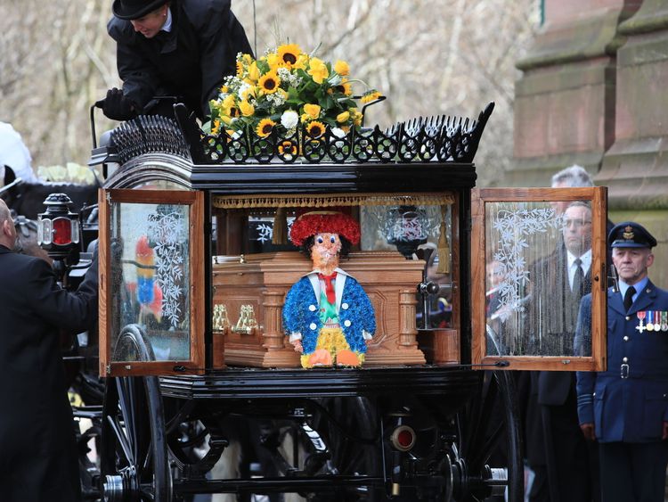 One of Sir Ken's trademark Diddymen was beside his coffin