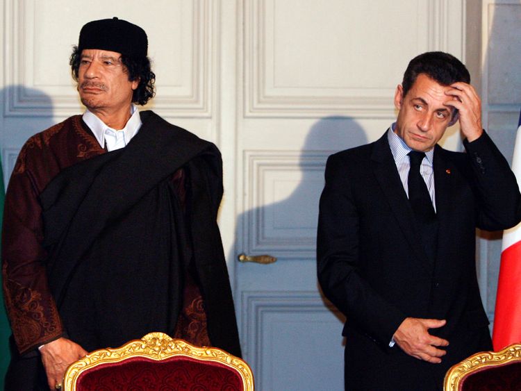 Nicolas Sarkozy and Muammar Gaddafi attend a ceremony for the signature of 10 billion euros of trade contracts between the two countries at the Elysee Palace in Paris, 2007