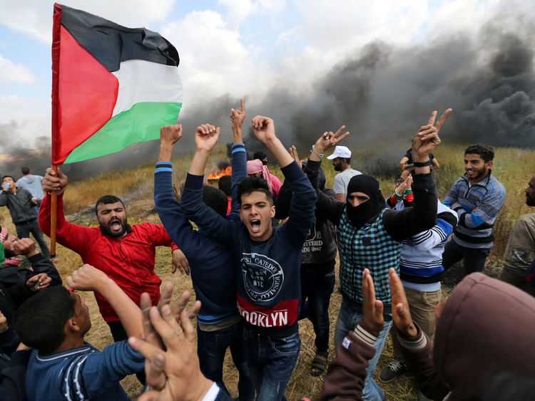 Palestinians shout during clashes with Israeli troops