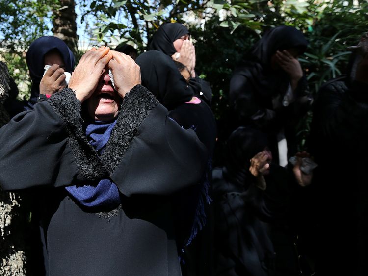 Relatives of a Palestinian farmer who was killed along Israel border with Gaza mourn