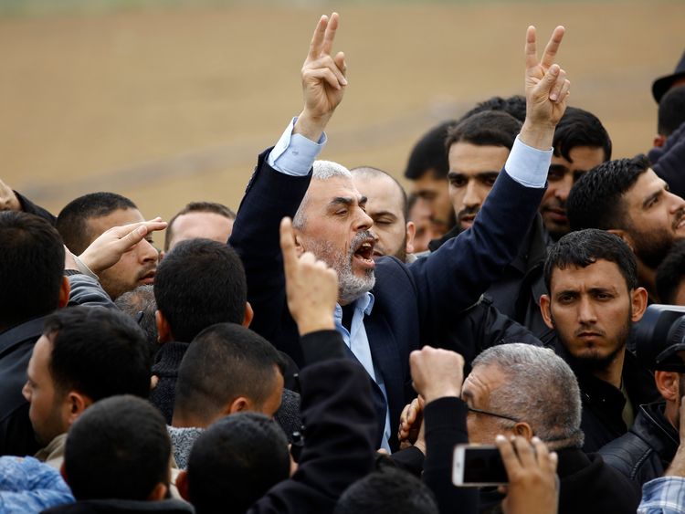 Islamist Hamas movement leader Yahya Sinwar (C) shouts slogans during the protest