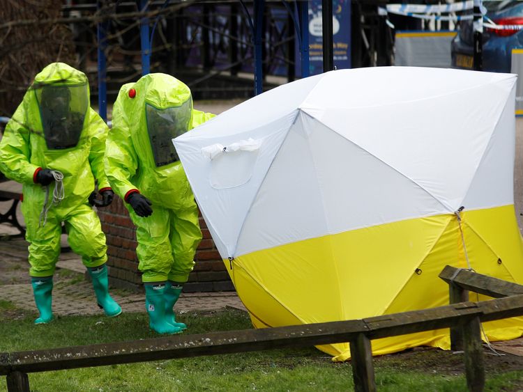 The forensic tent, covering the bench where Sergei Skripal and his daughter Yulia were found, is repositioned by officials in protective suits 