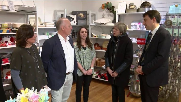 Theresa May meets shop owners in Salisbury, affected by the recent attack.