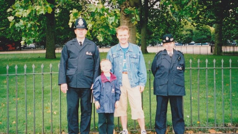 Alexander and Anatoly Livinenko pose with two police officers in the UK before his death