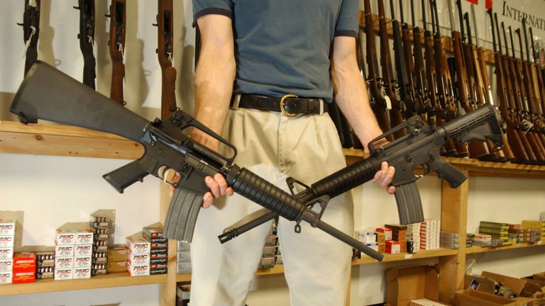 DENVER, CO - SEPTEMBER 13: The Manager of Dave&#39;s Guns holds two Colt AR-15&#39;s the gun on the right has a Bayonet Mount, Flash Supressor and a Collapsable Stock and can have a magazine high capacity load with more than 30 rounds and be purchased by civilians as of today, the gun on the left was legal to purchase and own with a 10 magazine round during the SAW Ban (Semi Automatic Wepons ban). Between 1994 and September 13, 2004 12:01am the AR-15 with the above items could only be sold to Law Enforcement and Military but today is know legal to civilians to purchase with the Brady Bill being expired. (Photo by Thomas Cooper/Getty Images)