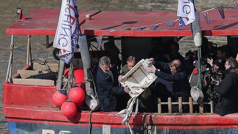 Nigel Farage and other Brexiteers dump dead fish into the Thames