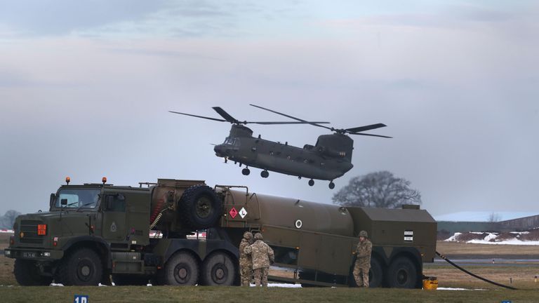 An RAF Chinook helicopter arrives at Carlisle airport before delivering supplies to communities still cut off after recent heavy snow in Cumbria
