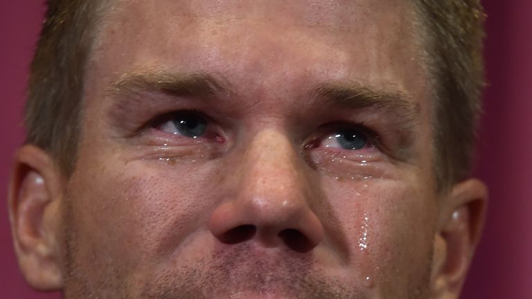 Australian cricketer David Warner cries as he speaks at a press conference at the Sydney Cricket Ground (SCG) in Sydney on March 31, 2018, after his return from South Africa