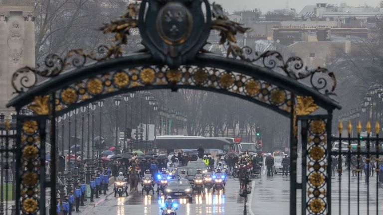 The funeral convoy arrives for the ceremony